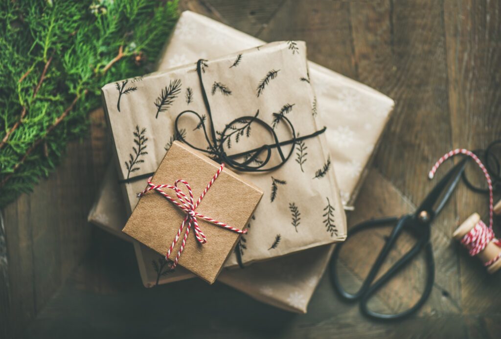 Presents under a Christmas tree. Wrapped and tied with string