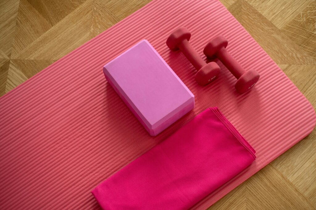 Home workout equipment under $100. Yoga mat and dumbbells home workout equipment.